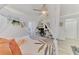 Cozy bedroom with decorative canopy, modern furnishings and light wood floors at 4129 Palisades Ave, North Port, FL 34287