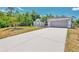 Charming single-story home with a large driveway and attached two-car garage at 4129 Palisades Ave, North Port, FL 34287