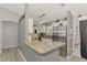 Well-equipped kitchen with stainless steel appliances, granite countertops, and modern lighting fixtures at 4129 Palisades Ave, North Port, FL 34287