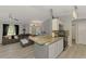 Bright open living space with an eat-in kitchen, stainless appliances, pendant lights, and comfortable seating at 4129 Palisades Ave, North Port, FL 34287