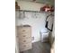 Walk-in closet featuring a dresser, wire shelving, a rod for hanging clothes, and a laundry basket at 618 Bird Bay S Dr # 109, Venice, FL 34285