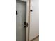 Apartment door to unit 109 features updated hardware and neutral paint at 618 Bird Bay S Dr # 109, Venice, FL 34285