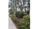 Professionally landscaped grounds feature vibrant flowers and greenery, enhancing curb appeal at 618 Bird Bay S Dr # 109, Venice, FL 34285