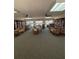 Community library featuring books and seating, with view to the tennis court at 618 Bird Bay S Dr # 109, Venice, FL 34285