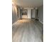 Spacious living room with hardwood floors, neutral paint, and ample natural light at 618 Bird Bay S Dr # 109, Venice, FL 34285