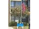 Image of the Bird Bay Leisure office with vibrant flowers and the American flag displayed at 618 Bird Bay S Dr # 109, Venice, FL 34285
