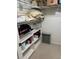 Spacious pantry with multiple shelves, ideal for organized storage of food, supplies, and household items at 618 Bird Bay S Dr # 109, Venice, FL 34285