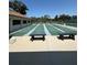 Enjoy the shuffleboard area with seating and shade, perfect for leisure and socializing with neighbors at 618 Bird Bay S Dr # 109, Venice, FL 34285