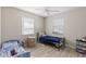 Bright bedroom features two windows, a ceiling fan, and a hardwood floor at 6309 Pontiac Ln, North Port, FL 34287