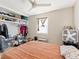 The bedroom features a ceiling fan, a window with curtains, and a closet with ample storage at 6309 Pontiac Ln, North Port, FL 34287