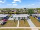 Aerial view of home with well-manicured lawn and paved driveways at 6309 Pontiac Ln, North Port, FL 34287