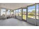 Enclosed lanai with outdoor seating, featuring a water view at 6309 Pontiac Ln, North Port, FL 34287