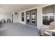 Covered patio with gray double-doors and outdoor chairs at 6309 Pontiac Ln, North Port, FL 34287