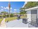 Outdoor patio featuring a grill, fire table, and seating, perfect for enjoying waterfront outdoor living at 6309 Pontiac Ln, North Port, FL 34287