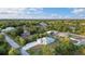 Aerial view of the single story home nestled in a lush, green neighborhood at 7122 Turner St, Englewood, FL 34224