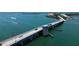 Aerial view of bridge with cars, boats, and waterfront homes and businesses at 7122 Turner St, Englewood, FL 34224