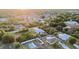 Panoramic aerial shot showcasing a neighborhood with scattered homes, trees, and blue skies at 7122 Turner St, Englewood, FL 34224