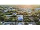 Aerial view of a cozy home nestled among trees with backyard pool offering a glimpse of tranquil suburban living at 7122 Turner St, Englewood, FL 34224