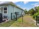 Fenced backyard featuring a grill and plenty of room, ensuring privacy and security for outdoor activities at 7122 Turner St, Englewood, FL 34224