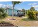 Spacious backyard with above ground pool, patio and lush tropical landscaping to provide a private and relaxing outdoor oasis at 7122 Turner St, Englewood, FL 34224