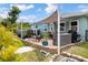 Backyard features an above ground pool, patio with outdoor dining, hot tub, and well-maintained landscaping at 7122 Turner St, Englewood, FL 34224