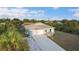 Charming single-story home with a well-manicured lawn, long driveway and attached two-car garage at 7122 Turner St, Englewood, FL 34224