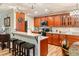 Modern kitchen featuring granite countertops, stainless steel appliances, and bar seating at 7122 Turner St, Englewood, FL 34224