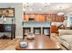 Open kitchen with bar seating and wooden cabinets at 7122 Turner St, Englewood, FL 34224