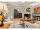 Cozy living room with a fireplace, hardwood floors, and comfortable seating at 7122 Turner St, Englewood, FL 34224