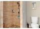 Shower featuring pebble flooring and tile walls at 7122 Turner St, Englewood, FL 34224