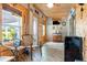 Inviting sun room with wooden walls, casual seating, and ample natural light at 7122 Turner St, Englewood, FL 34224