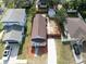 Aerial perspective of a cozy home with fenced yard and convenient driveway offering a private and welcoming appeal at 7413 S Elliott St, Tampa, FL 33616