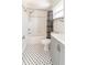 Bathroom features tile floors, a shower-tub combo, and a modern vanity at 7413 S Elliott St, Tampa, FL 33616