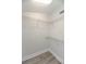 Organized walk-in closet with wire shelving for efficient storage and accessibility at 7413 S Elliott St, Tampa, FL 33616
