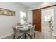 A bright dining area with a rustic sliding barn door at 7413 S Elliott St, Tampa, FL 33616