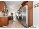 Spacious kitchen boasts stainless steel appliances, granite counters, and wood cabinets at 7413 S Elliott St, Tampa, FL 33616