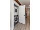 Efficient laundry closet featuring a stacked washer and dryer at 7413 S Elliott St, Tampa, FL 33616