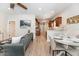 Open living room boasts neutral paint, an open floor plan and modern furnishings at 7413 S Elliott St, Tampa, FL 33616