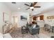 Open-concept living space with modern decor, seamlessly connecting to the kitchen and dining area at 7413 S Elliott St, Tampa, FL 33616