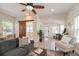 Inviting living room featuring modern furnishings and natural light and a sliding wood barn door at 7413 S Elliott St, Tampa, FL 33616
