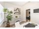 Bright office area features neutral colors, a modern white desk and stylish decor at 7413 S Elliott St, Tampa, FL 33616