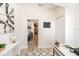 Bright office area features neutral colors, a modern white desk and stylish decor at 7413 S Elliott St, Tampa, FL 33616