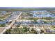 A picturesque waterfront community featuring beautiful homes and winding canals leading to open water at 8084 Burwell Cir, Port Charlotte, FL 33981