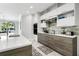 Contemporary kitchen with modern appliances, sleek countertops, and ample cabinet space at 8084 Burwell Cir, Port Charlotte, FL 33981