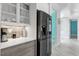 Kitchen counter and stainless-steel refrigerator appliance at 8084 Burwell Cir, Port Charlotte, FL 33981
