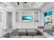 Living room with a built-in entertainment center and view to the outdoor pool area at 8084 Burwell Cir, Port Charlotte, FL 33981