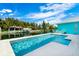 Beautiful pool, patio and canal with lush tropical landscaping at 8084 Burwell Cir, Port Charlotte, FL 33981
