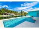 Stunning waterfront pool area with views of the canal and palm trees at 8084 Burwell Cir, Port Charlotte, FL 33981