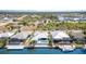 Waterfront home featuring a backyard pool and a boat dock, perfect for enjoying waterfront living and leisure at 8084 Burwell Cir, Port Charlotte, FL 33981