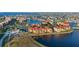 Aerial view featuring residences, water, and palm trees at 95 Vivante Blvd # 9524, Punta Gorda, FL 33950